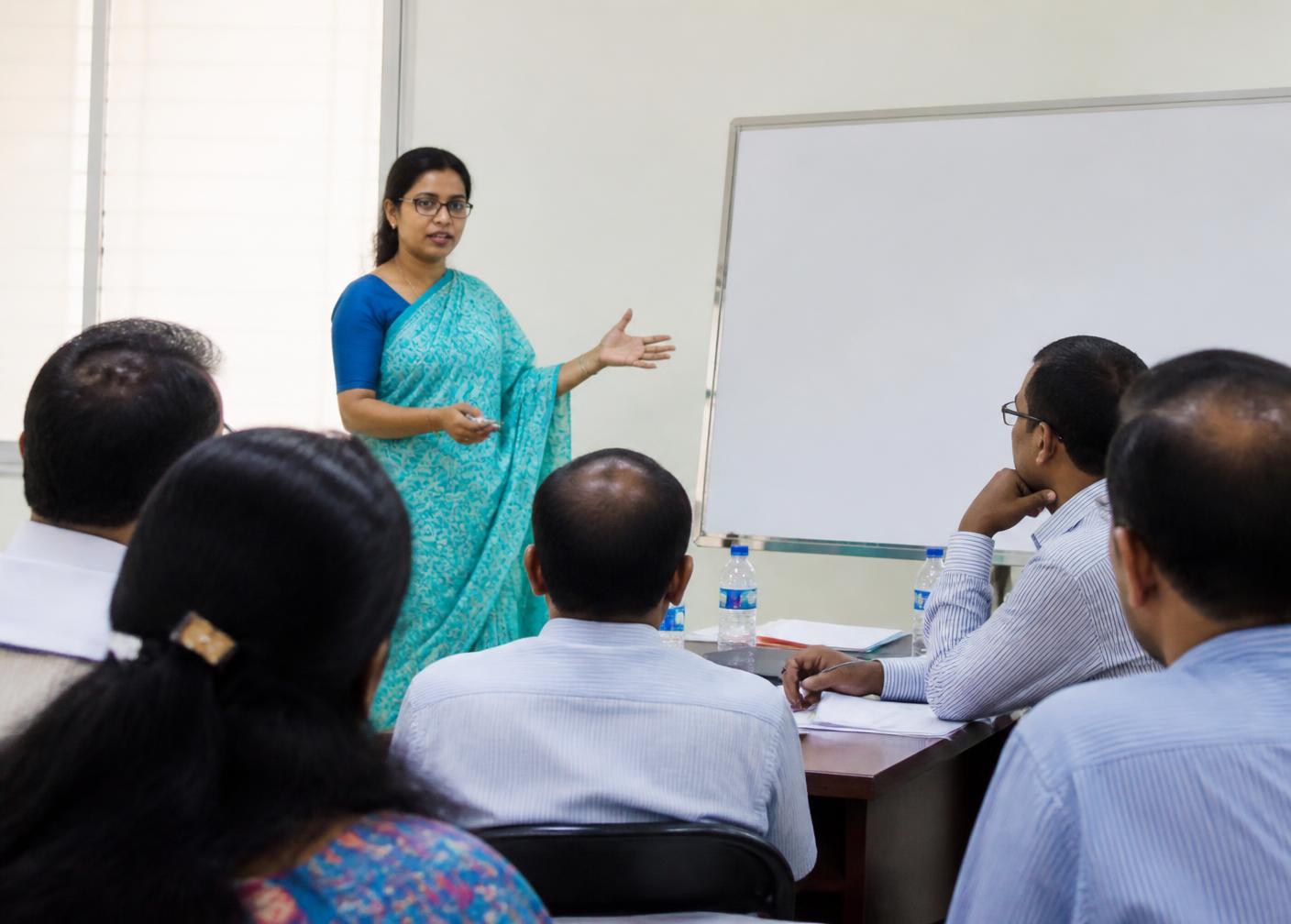 A trainer leading a capacity-building session with institutional partners